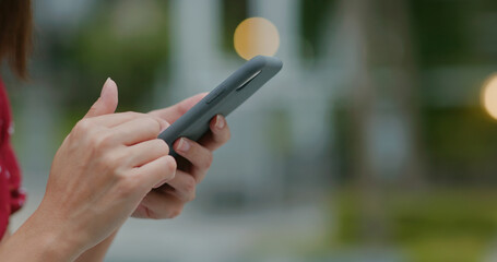 Woman use of mobile phone at outdoor