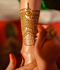 Henna is applied to the hands of a beautiful  Hindu Bride on her wedding.