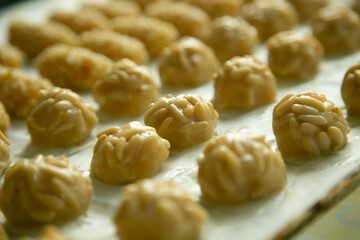Almond and pine nuts Panellets . Traditional Catalan sweet made with potato, egg, sugar, almonds and pine nuts. Prepares to celebrate Halloween and November 1st