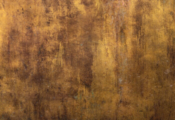 artistic golden metal rough surface with irregular yellow and dark brown tones - worn steampunk background with dirty texture and scratches for an epic wallpaper