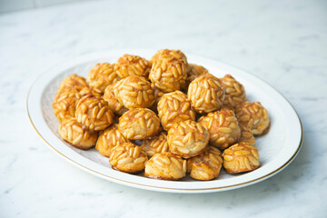 Almond and pine nuts Panellets . Traditional Catalan sweet made with potato, egg, sugar, almonds and pine nuts. Prepares to celebrate Halloween and November 1st