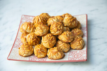 Almond and pine nuts Panellets . Traditional Catalan sweet made with potato, egg, sugar, almonds and pine nuts. Prepares to celebrate Halloween and November 1st