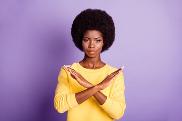 Photo of strict dark skin girl cross hands stop signal concept wear yellow sweater isolated over...