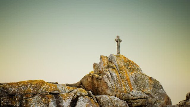 stone cross on the rock Beg Ar Groas