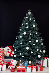 Christmas tree pine with gifts new year decor black background