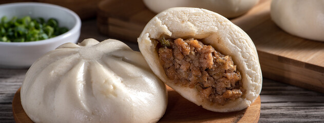 Close up of fresh delicious baozi, Chinese steamed meat bun.