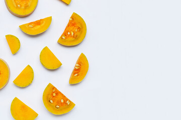Butternut squash slices on white background.
