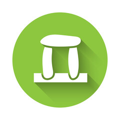 White Stonehenge icon isolated with long shadow. Green circle button. Vector.