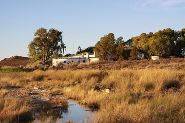 farmhouse next to river in the karoo