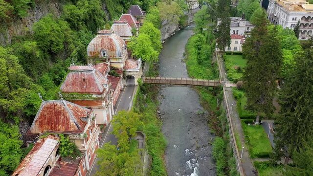 4K Aerial drone view of Baile Herculane - Thermal resort in Romania, gorgeous Austro-Hungarian Imperial Baths between the mountains