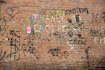 Old brick wall with graffiti