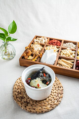 Stewed black-bone chicken with red dates and angelica in Chinese health soup
