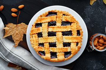 Close up of a berry tart pie on wooden table