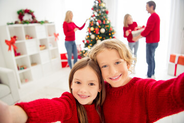 Fototapeta na wymiar Closeup photo of full big family five people meeting two little kids cuddle toothy smile make shoot selfie parents decorate x-mas tree wear red jumper jeans in home living room indoors