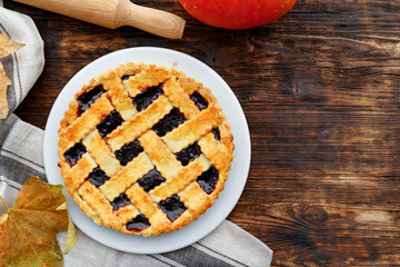 Close up of a berry tart pie on wooden table