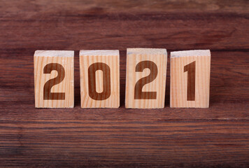 Wooden block with numbers 2021. Concept of beginning of new year