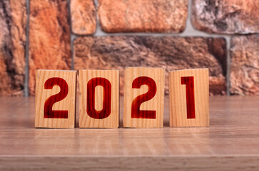 Wooden block with numbers 2021. Concept of beginning of new year