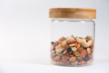  a jar of mixed nut isolated on white background 