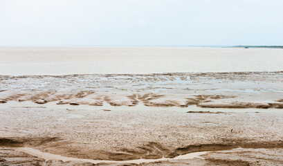  The Yellow Sea beach under a clear sky, mud strips formed by alluvial sediments, Dongtai, Jiangsu, China
