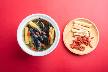 Stewed black chicken soup with codonopsis and wolfberry