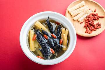 Stewed black chicken soup with codonopsis and wolfberry
