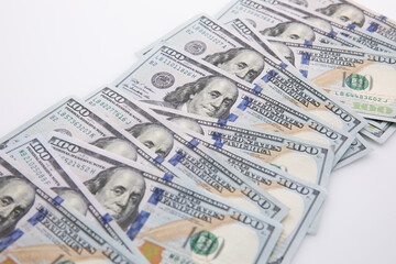 collection of hundred-dollar banknotes isolated on white background, close view