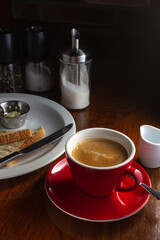 cup of coffee, milk and a toast