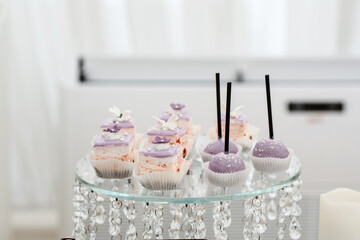 sweet cakes beautiful arranged on the white table