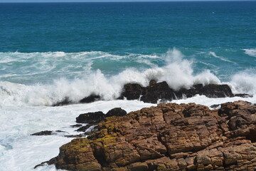 waves crashing on rocks