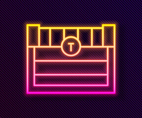 Glowing neon line Antique treasure chest icon isolated on black background. Vintage wooden chest with golden coin. Vector.