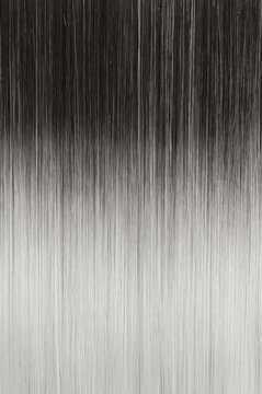 close up of texture of single piece clip in straight black to ash blonde ombre style synthetic hair extensions