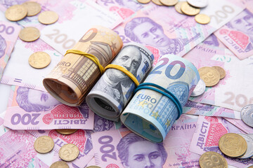 collection of dollar and hryvnia with euro banknotes and coins, close view
