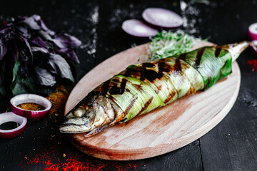 Grilled mackerel on a wooden board