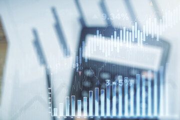 Multi exposure of virtual abstract financial graph interface on blurry calculator and papers...