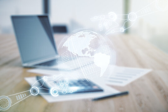 Abstract virtual robotics technology hologram with globe sketch on calculator and laptop background. Robot development and automation concept. Multiexposure