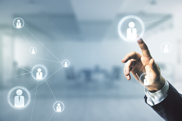 Man hand clicks on abstract virtual social network hologram on blurred office background. Double exposure