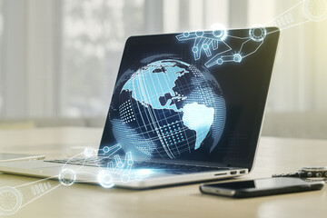 Creative concept of robotics technology with globe sketch on modern laptop background. Robot development and automation concept. Multiexposure