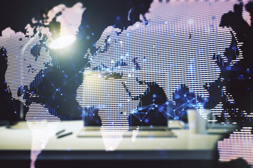 Abstract creative world map on modern laptop background, international trading concept. Multiexposure