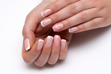 Classic French manicure on short square nails with flowers on the ring fingers. Wedding nail designs. 