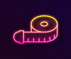 Glowing neon line Tape measure icon isolated on black background. Measuring tape. Vector.