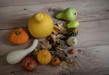 Naklejka na ściany i meble Vegetables and fruits on a wooden background