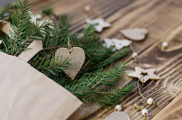 wooden new year's toys and Christmas trees in a koftovom package on a wooden background