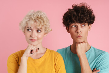 Pensive young couple thinking isolated
