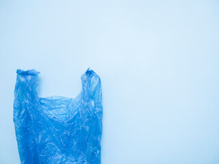 Blue plastic bag on light blue background