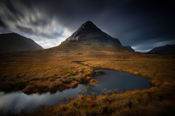 long exposure of the mountain named Bauchaille Etive Beag at lochan na fola in glencoe, highlands, scotland.