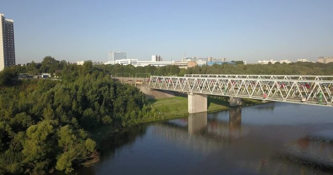 4K high quality summer day aerial drone video of Moscow River channel metal arched railway bridge in Moscow, Russia