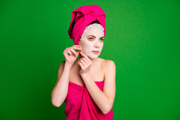 Photo of beautiful lady in shower taking off cotton face mask wear towels body head isolated green color background