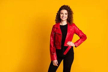 Fototapeten Friseursalon Portrait of her she nice charming cheerful cheery wavy-haired girl wear leather coat isolated over bright vivid shine yellow color background  © deagreez