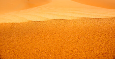 on the top of the sand dune, closeup of a sand dune in the desert, with the colorful details 
