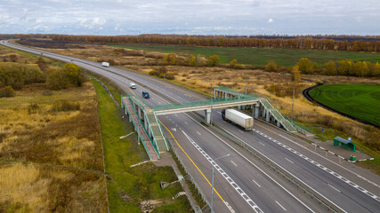 Aerial view of motorway intersections, of speeding cars and trucks.